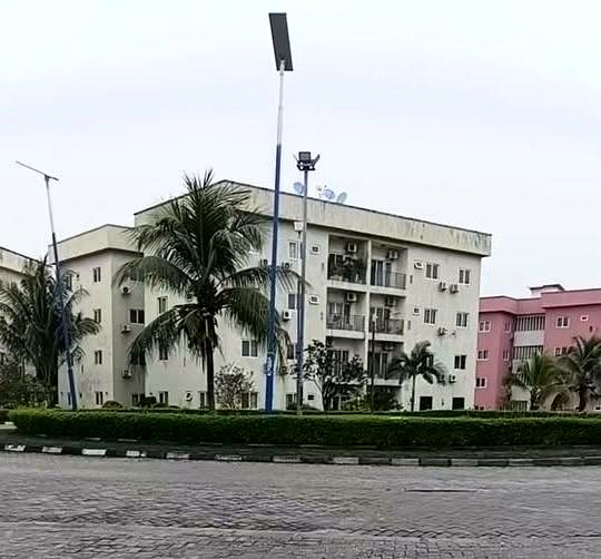 Tree lined estate road and apartment blocks at Golf Estate, Port Harcourt, where Manordow Properties lets a five bedroom duplex